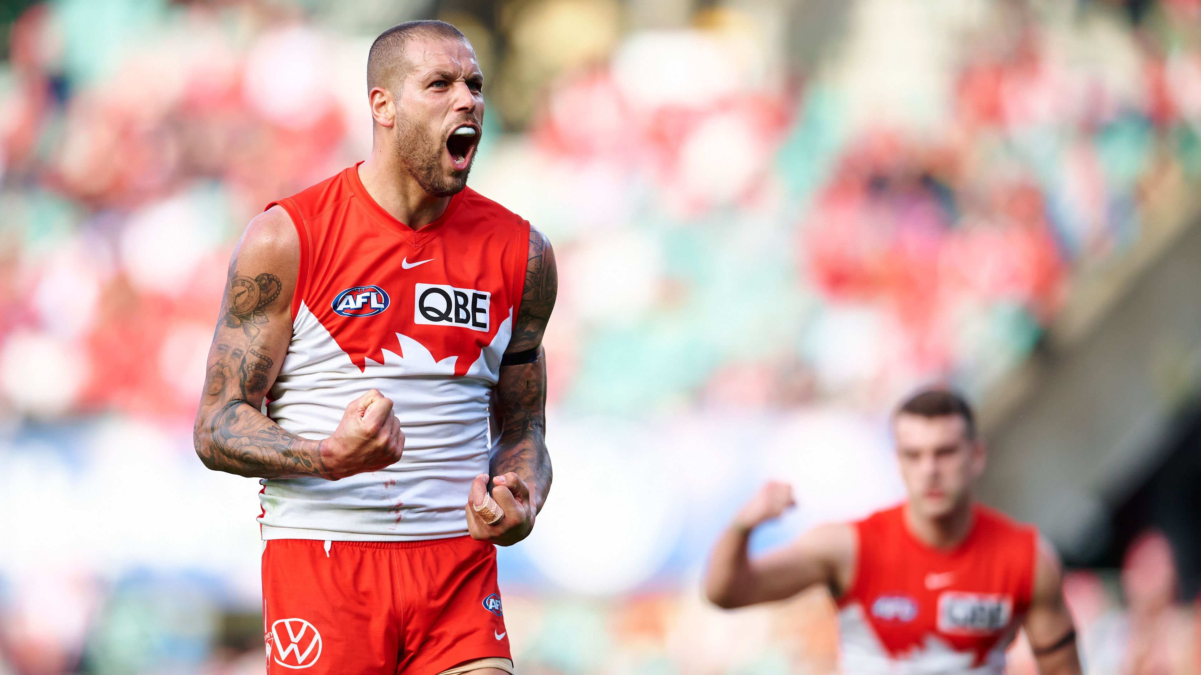 Lance Franklin moves kicks past Garry Ablett Snr as Swans down Crows