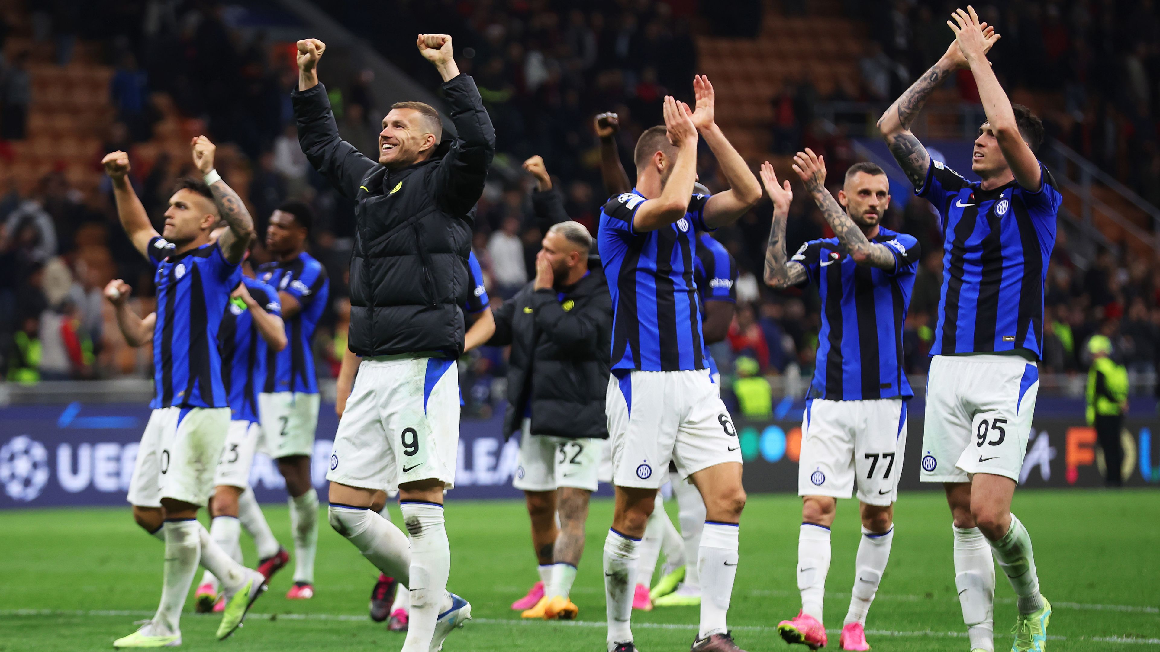 Inter players celebrate in front of their fans after the UEFA Champions League semi-final first leg match between AC Milan and FC Internazionale.