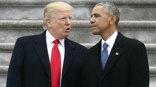 New President Donald Trump talks to former President Barack Obama on Capitol Hill as the reins are handed over on January 20, 2017.