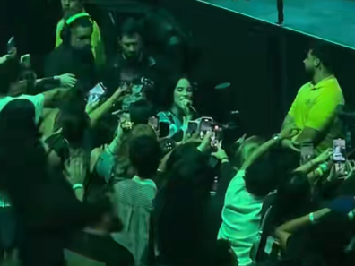 Billie Eilish pulled by fan at Miami concert