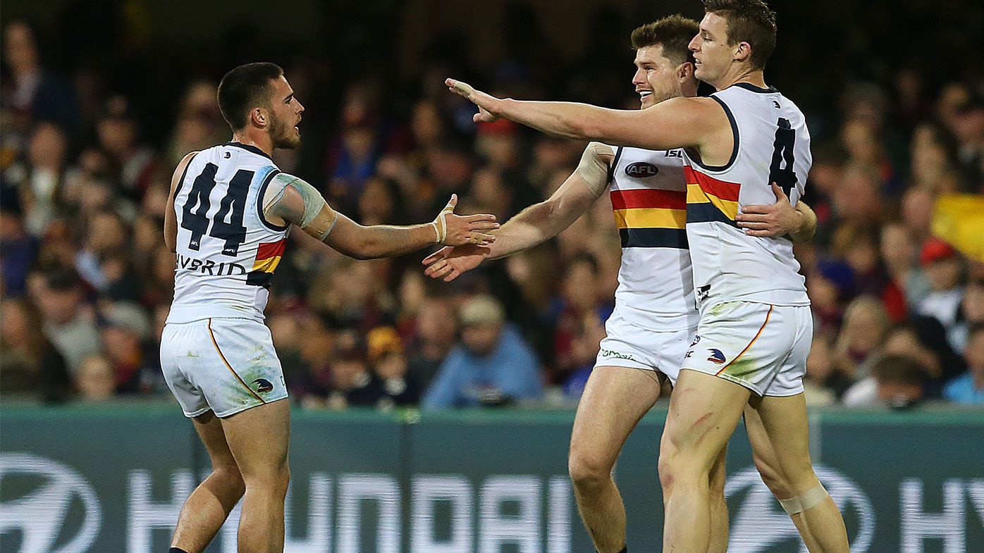 Adelaide hang on to end Lions' run in AFL