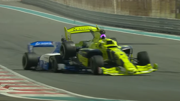 Two AI-controlled cars collide at the Yas Marina Circuit.