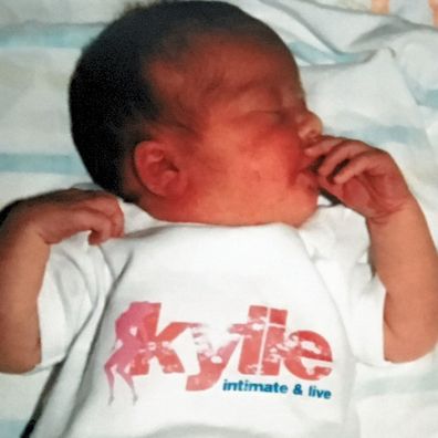 Terence Belletty's daughter in Kylie merch as a newborn.