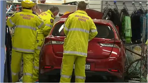 Three people have been hospitalised after an elderly driver crashed into a Salvation Army shopfront in Craigie.