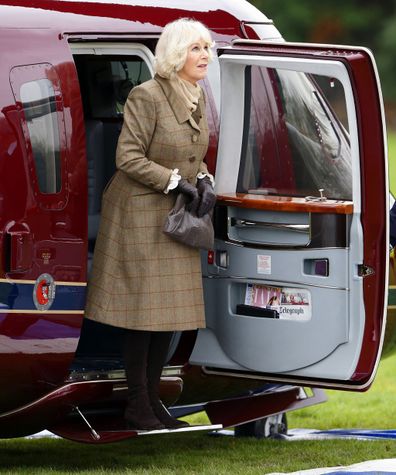 Camilla, Duchess of Cornwall, disembarking a Sikorsky Helicopter (The Queen's Helicopter Flight) in 2014. 