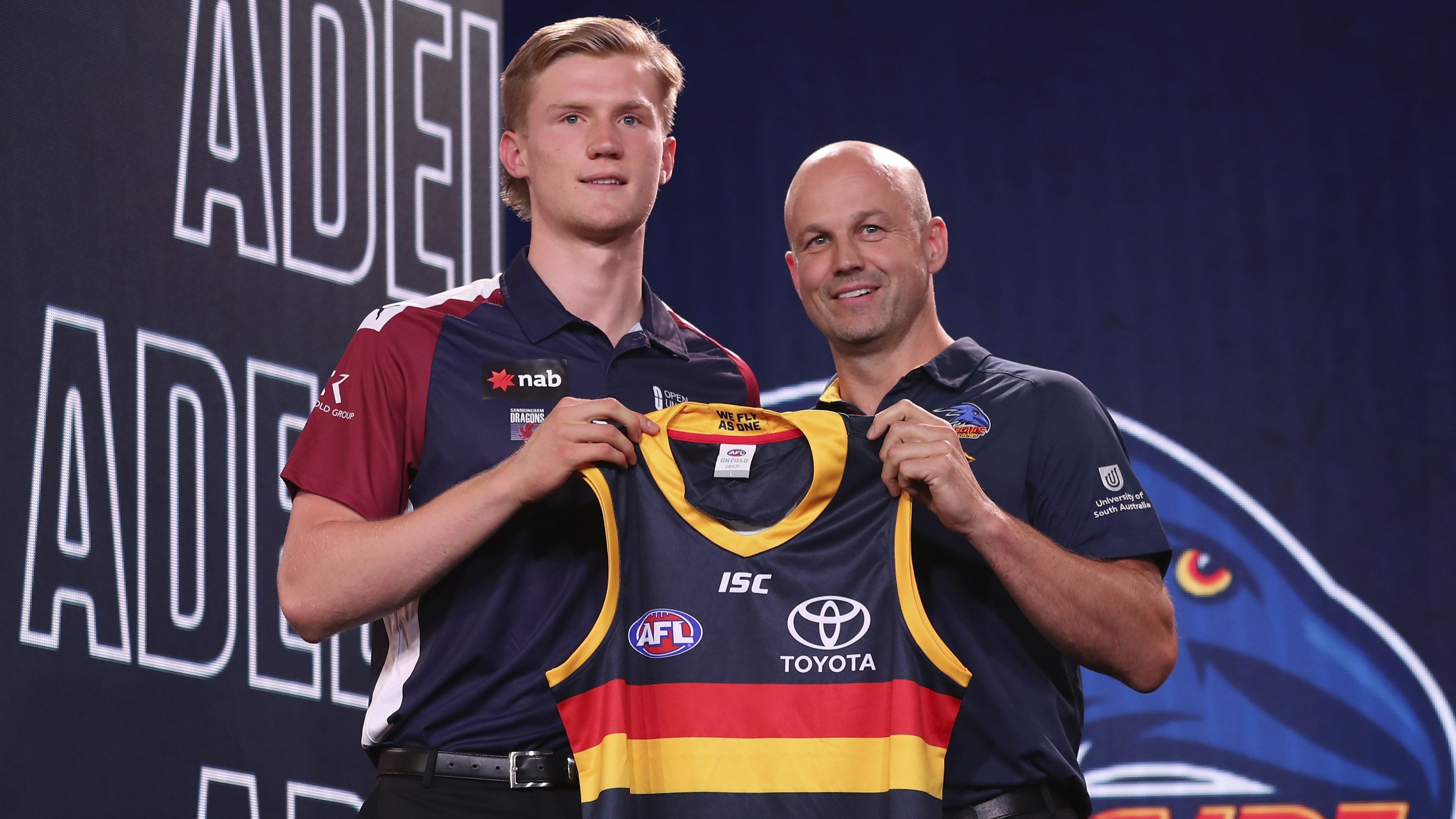 Fischer McAsey poses with Adelaide Crows coach Matthew Nicks during the 2019 AFL draft.