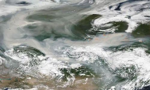 An image released by Nasa shows smoke from hundreds of forest fires covering most of Russia.