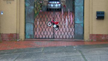 A child&#x27;s tricycle was left tied to the gate of the residence Cardinal George Pell spent the night at. A day earler the High Court overturned all convictions againbst Pell.