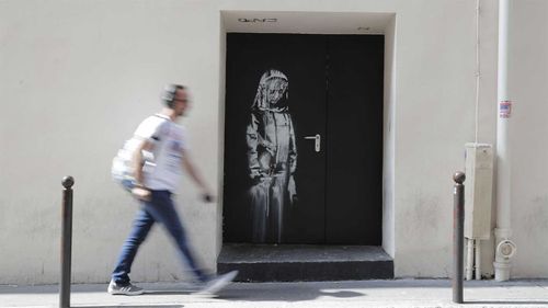 The Banksy artwork on the door of the Bataclan in Paris.