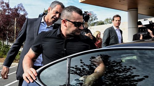 Anthony Koletti (2nd from left) the husband of Melissa Caddick leaves Lidcombe coroners court, NSW.  The coroner concluded that Melissa Caddick is dead however the cause, manner or time could not be determined. Koletti was described as an unreliable witness. May 25, 2023. Photo: Kate Geraghty