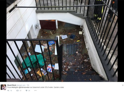 Mr Rock's stairwell looks more like a grubby metropolitan drain after his home was swamped by deluge. Source: Twitter