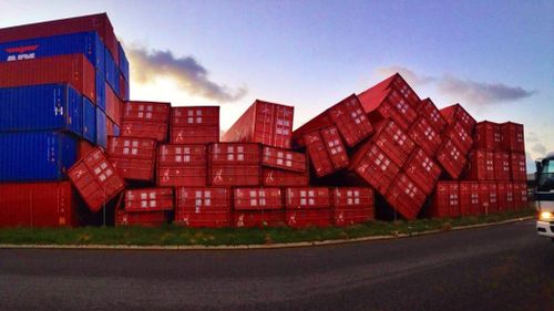 Shipping containers were blown over at Rous Head. (9NEWS)