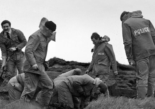 Police scour Saddleworth Moor for victims' bodies.