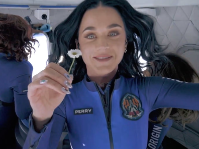 Katy Perry holds up a daisy during her flight to space with Blue Origin, April 2025