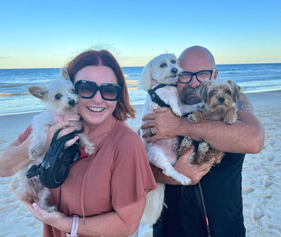 Shelly Horton with husband Darren and their three fur-kids.