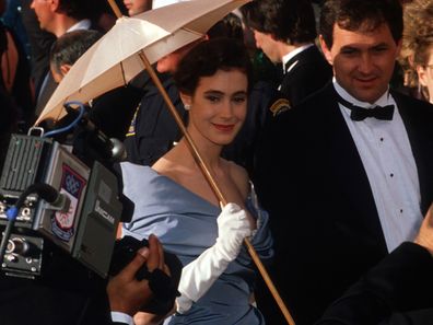 Actress Sean Young holds a parasol at the 1988 Academy Awards April 11, 1988 in Los Angeles, CA. 