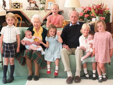 The Queen and Prince Philip surrounded by seven of their great-grandchildren at Balmoral Castle in 2018 (L-R front: Prince George, Queen with Prince Louis, Princess Charlotte, Prince Philip, Isla Phillips, Lena Tindall, Mia Tindall. Back: Savannah Phillips)