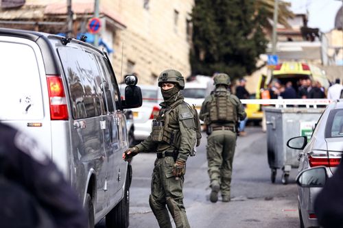 Israeli security personnel work near a scene where a suspected incident of shooting attack took place, police spokesman said, just outside Jerusalem's Old City January 28, 2023. 