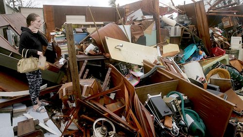 Haley Nelson inspects damages to her family properties in the Panama City, Florida, after Hurricane Michael made landfall along Florida's Panhandle.