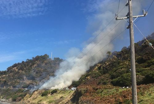 Police have begun a controlled burn on the Great Ocean Road. (Victoria Police)