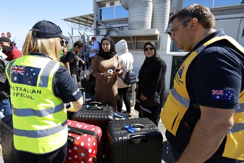 Australian nationals evacuated from Lebanon arrive at Larnaca International Airport on October 5, 2024 in Larnaca, Cyprus.  