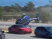 Helicopter hovers over Porsche outside Victory Hotel in Sellicks Hill, south of Adelaide.