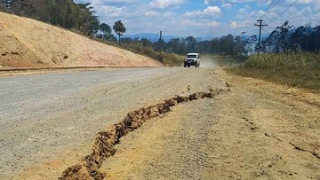 A large crack in a highway near the town of Kainantu, following a 7.6-magnitude earthquake in northeastern Papua New Guinea