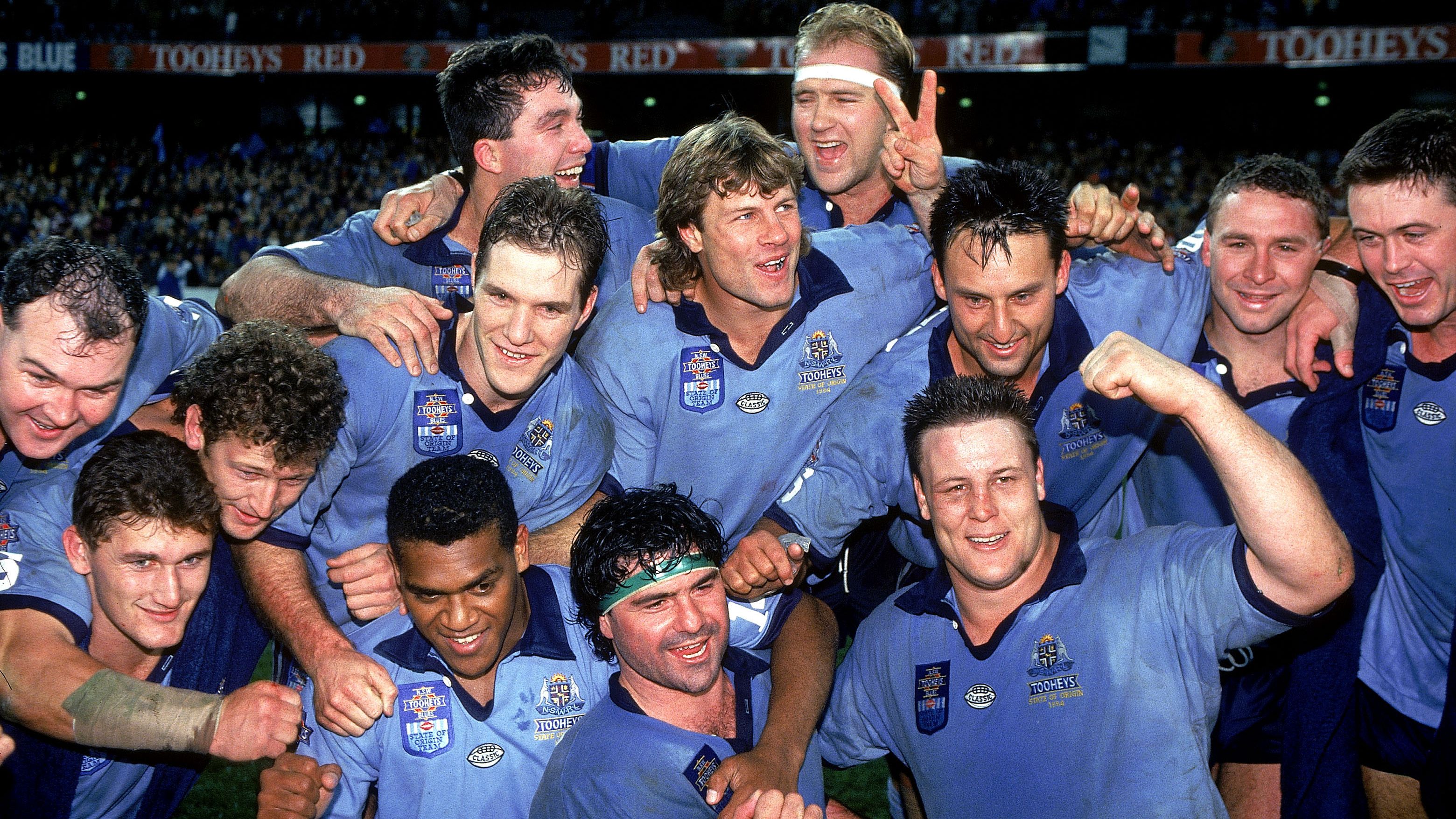 The Blues celebrate after winning game three and the 1994 Origin series 2-1 at Lang Park.
