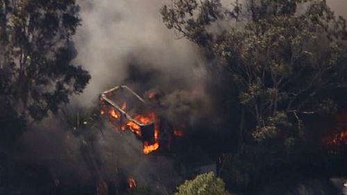 Fire consumes a building in a blaze near Penrith, in Sydney's west. (9NEWS)