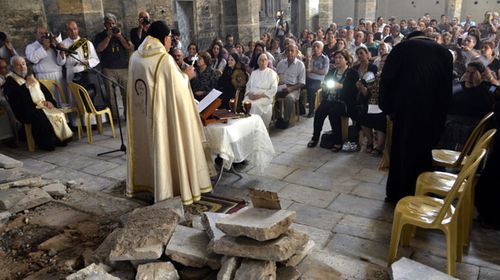 Iraqi Christians attend a mass at Mar Toma church in Mosul on Sunday for the first time since the liberation of the city from Islamic State. (Photo: AP).