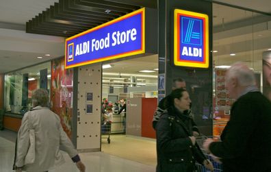 Aldi worker customers eating grapes
