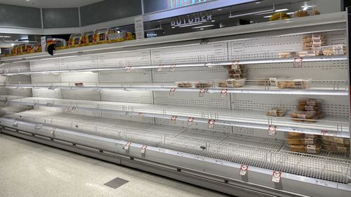 Empty supermarket shelves at Coles