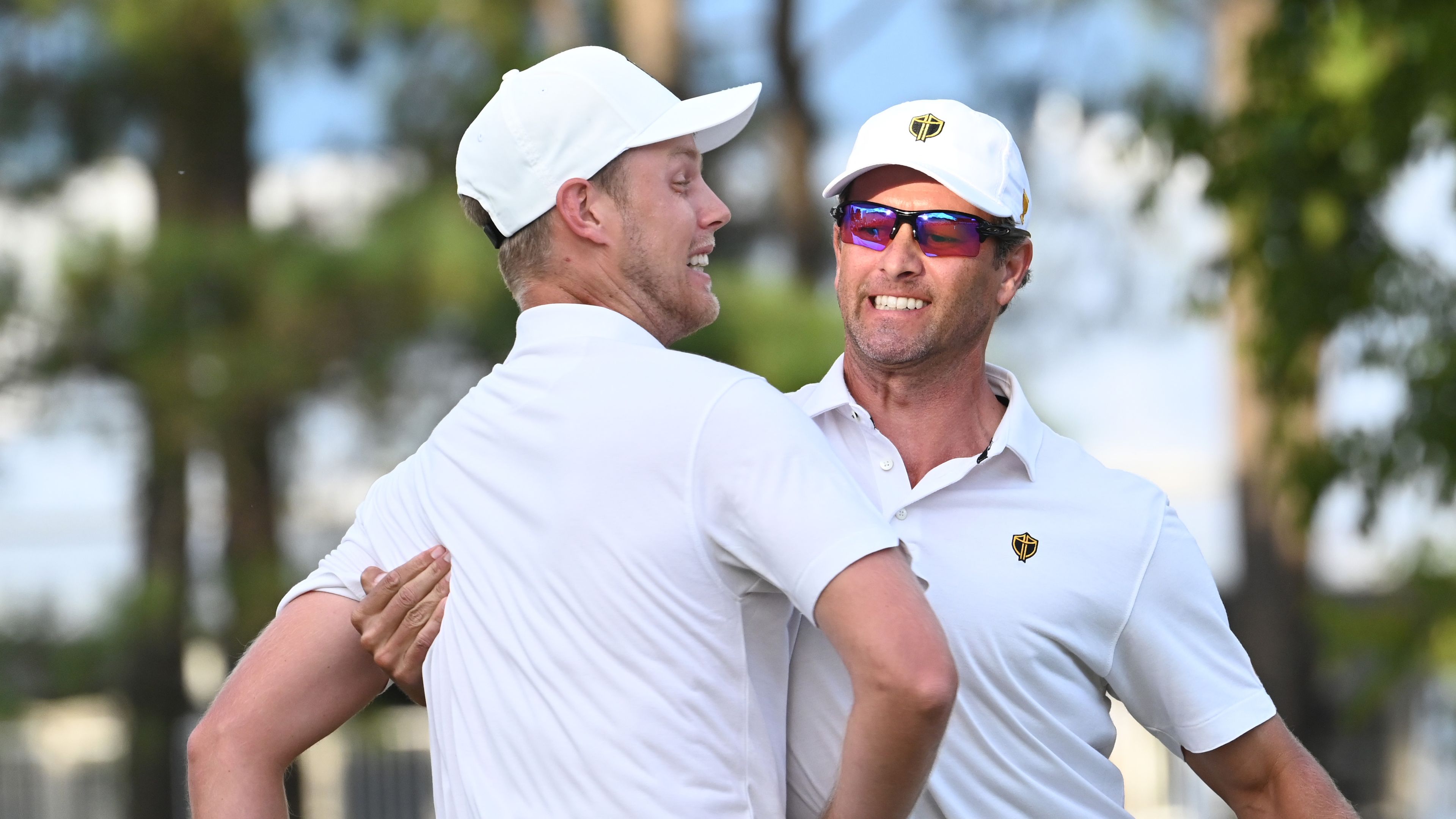 International Team Member Adam Scott of Australia celebrates with Cam Davis of Australia after making a putt during the Saturday afternoon Four-Ball Match Play of Presidents Cup at Quail Hollow September 24, 2022, in Charlotte, North Carolina. (Photo by Keyur Khamar/PGA TOUR via Getty Images)