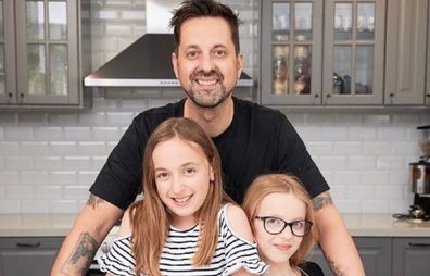 George 'Lunchbox Dad' with his daughters.