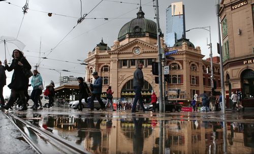 Soggy scenes in the CBD this morning. (AAP)