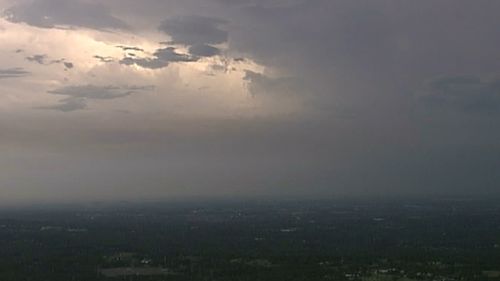 Black clouds cover Sydney's west as a severe thunderstorm rolls in. (9NEWS)