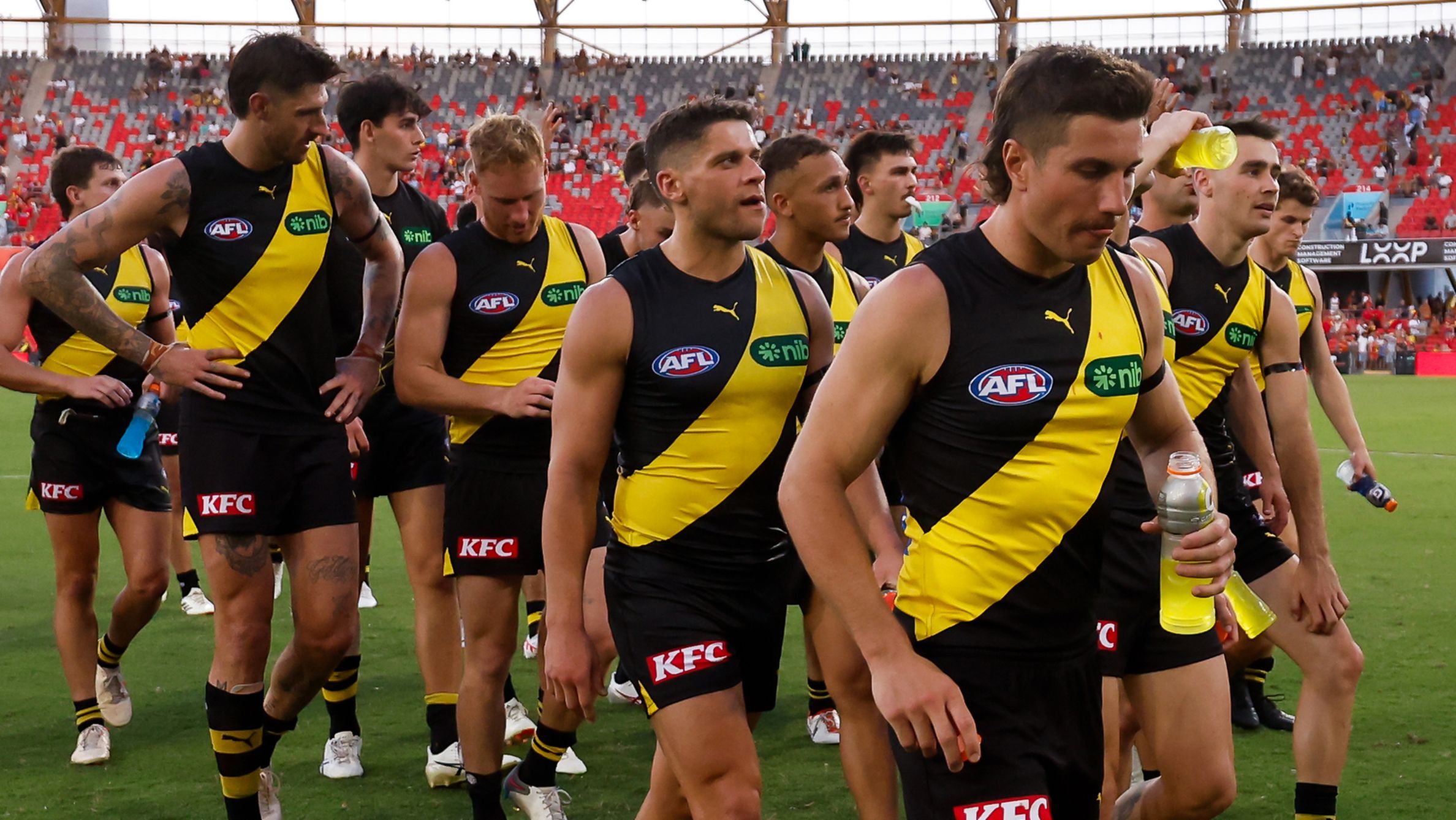 The Tigers leave the field after a loss during the 2024 AFL Opening Round match between the Gold Coast SUNS and the Richmond Tigers at People First Stadium on March 09, 2024 in Gold Coast, Australia. (Photo by Dylan Burns/AFL Photos via Getty Images)