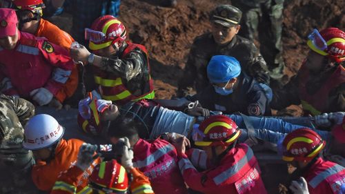Two survivors found alive in rubble 70 hours after Chinese landslide