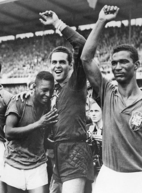 Brazil's 17-year-old Pele, left, weeps on the shoulder of goalkeeper Gilmar Dos Santos Neves, after Brazil's 5-2 victory over Sweden in the World Cup final soccer match, in Stockholm, Sweden on June 29, 1958. (AP Photo/File)