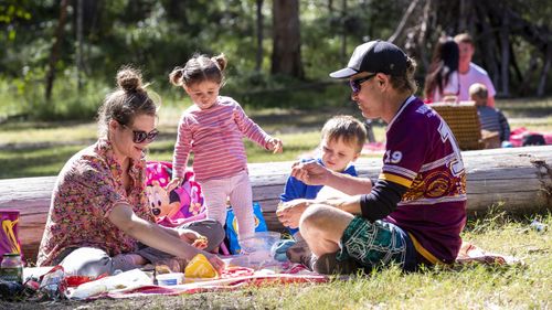 A family enjoys a picnic at Daisy Hill Forest Park in Brisbane, Saturday, May 2, 2020. 