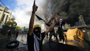 Protesters chant slogans during a demonstration in solidarity with the Palestinian people in Gaza, near the U.S. embassy in Aukar, a northern suburb of Beirut, Lebanon, Wednesday, Oct. 18, 2023 
