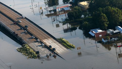 People launch boats from an overpass into floodwaters in the aftermath of Tropical Storm Harvey in Kountze, Texas. (AP)