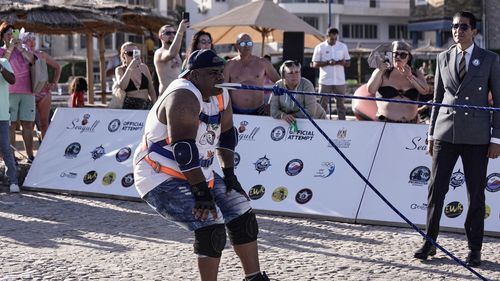 Egyptian wrestler Ashraf Mahrous, better known as Kabonga, pulls a 700-ton ship across the water with a rope held only by his teeth at the marina of the Red Sea resort of Hurghada, Egypt, Saturday, Sept. 27, 2025. (AP Photo/Amr Nabil)
