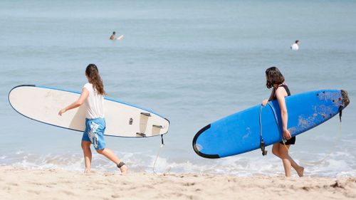 Tourists at Kuta Beach in Bali. (AAP)