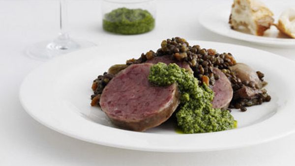 Poached cotechino with lentils