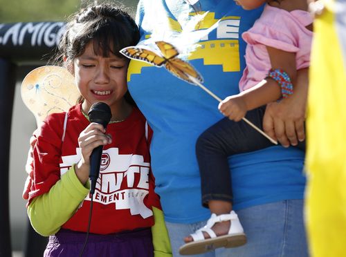 Akemi Vargas, 8, cries as she talks about being separated from her father during a protest against immigration family separation in the US. Picture: AAP