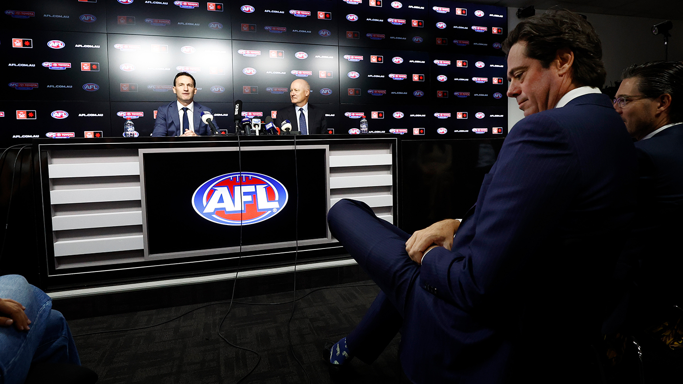 Incoming CEO Andrew Dillon and chairman of the AFL Richard Goyder address the media as outgoing CEO Gillon McLachlan watches on.