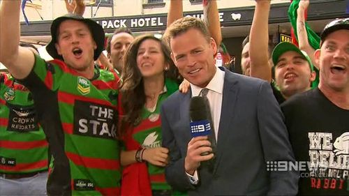 Tom Steinfort was doing a live cross with some Rabbitohs fans outside a Redfern pub.