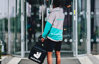 Deliveroo driver dropping off order