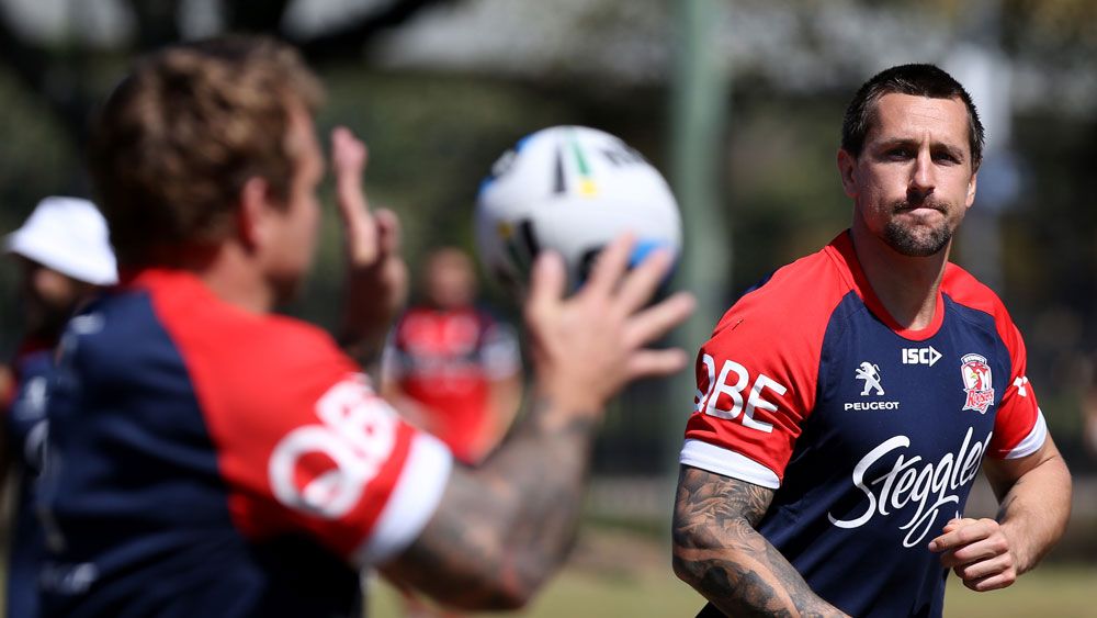 Mitchell Pearce passes the ball to Jake Friend at Roosters training. (AAP)